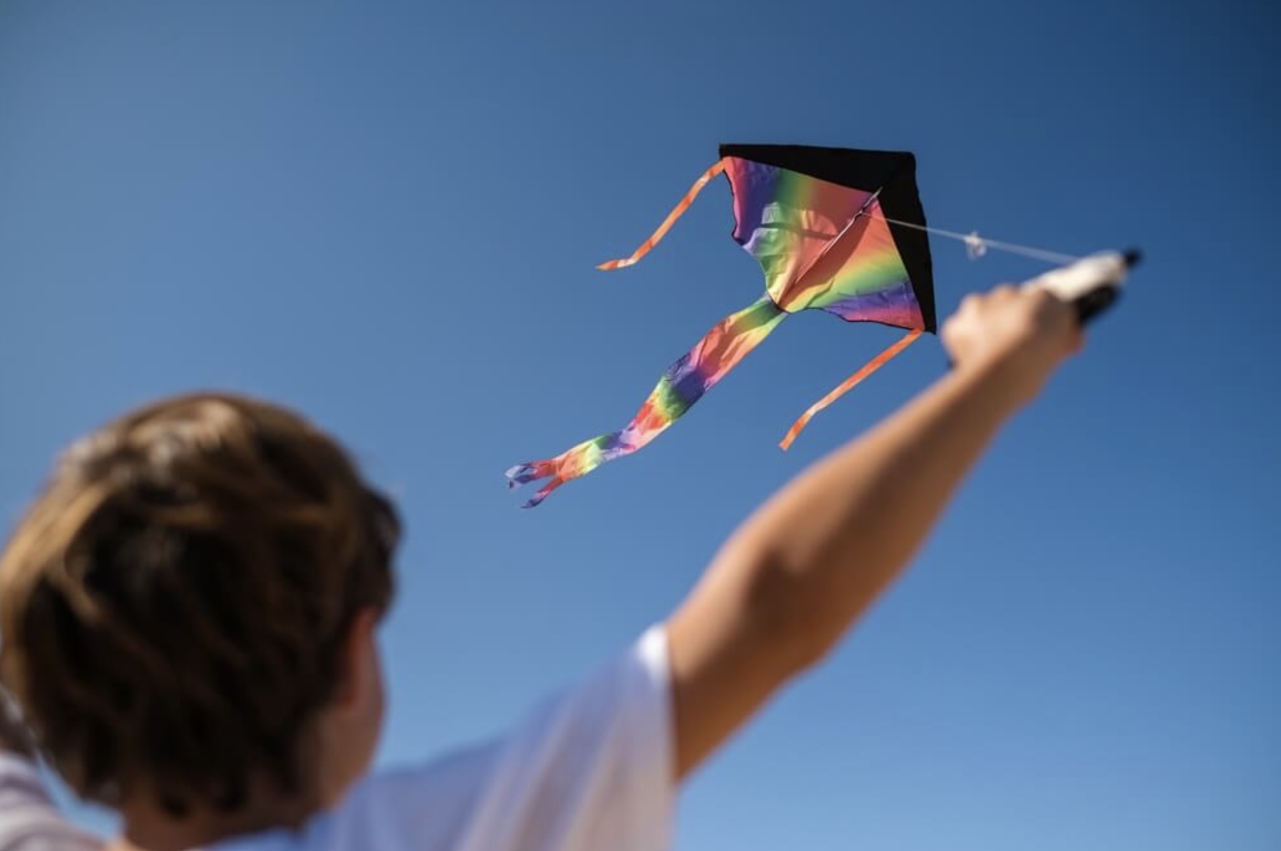 A boy flying a kite