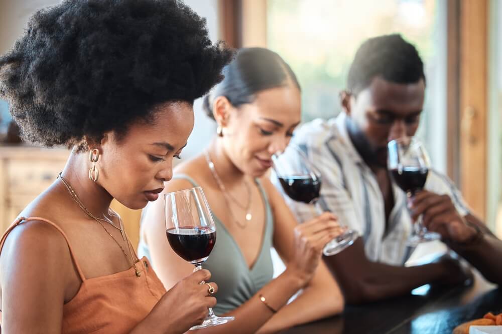 Friends tasting wine